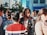A vibrant city street scene showcasing people wearing modern urban fashion.