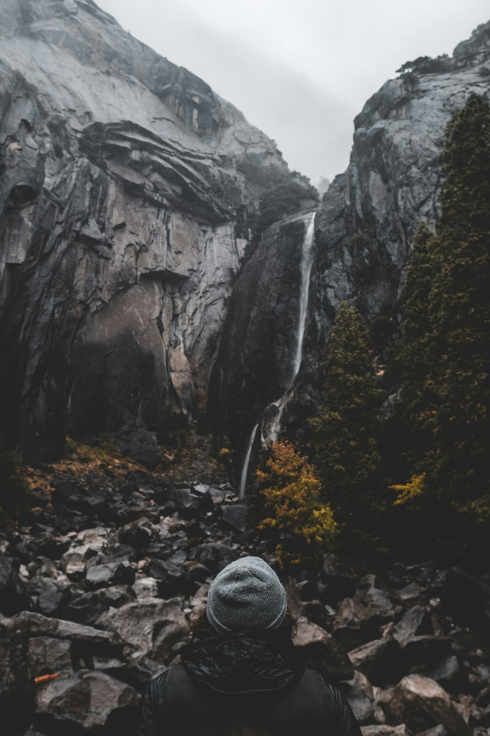 person standing in front of mountain