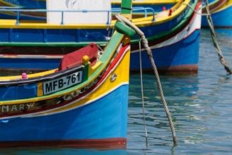 Colorful traditional boats floating on turquoise waters in the Philippines