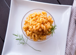 macaronis in bowl on plate
