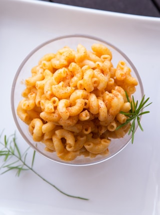 macaronis in bowl on plate