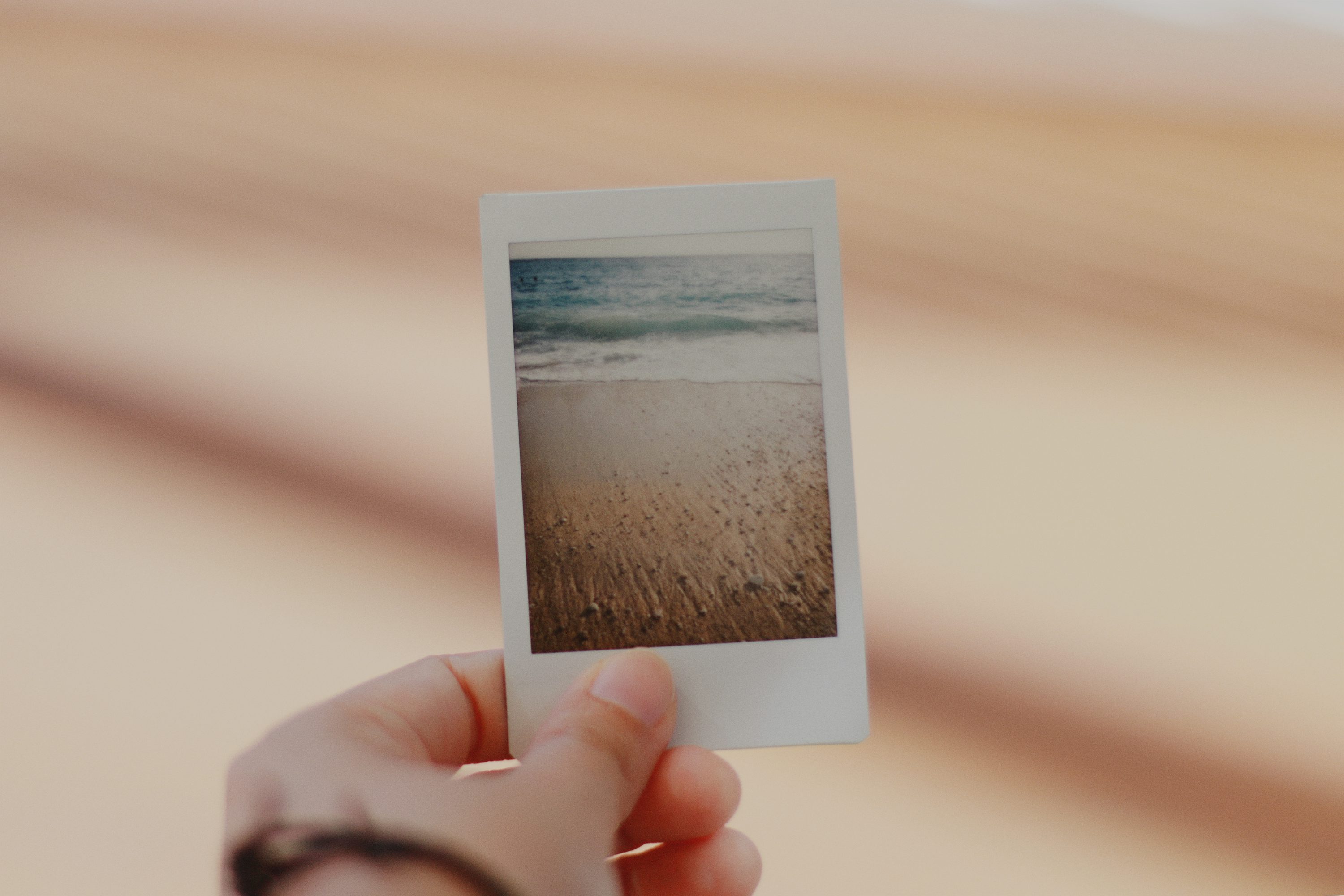 person holding film photo