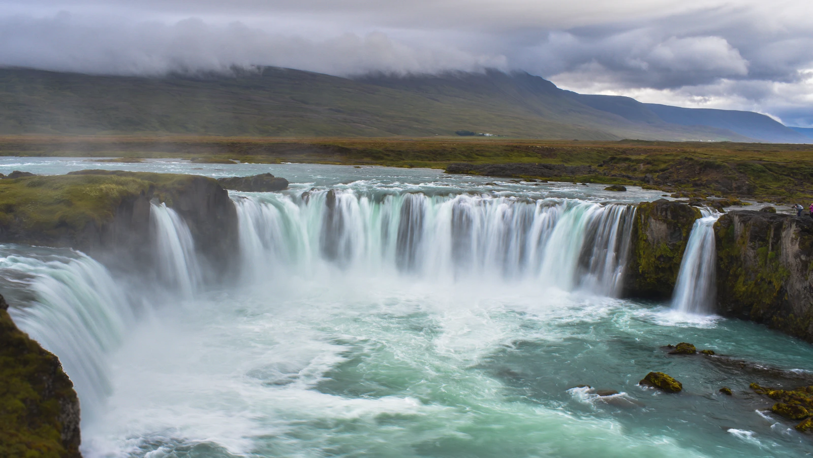 Godafoss waterfall cascading through the Icelandic landscape