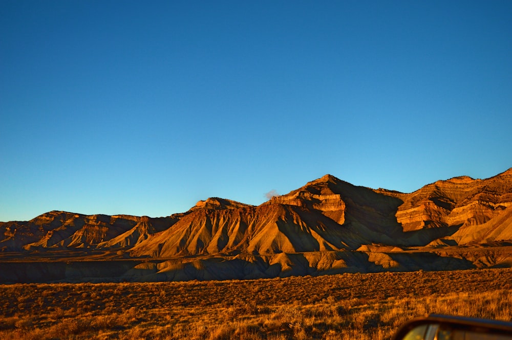 rocky mountain under clear blue sky during daytime