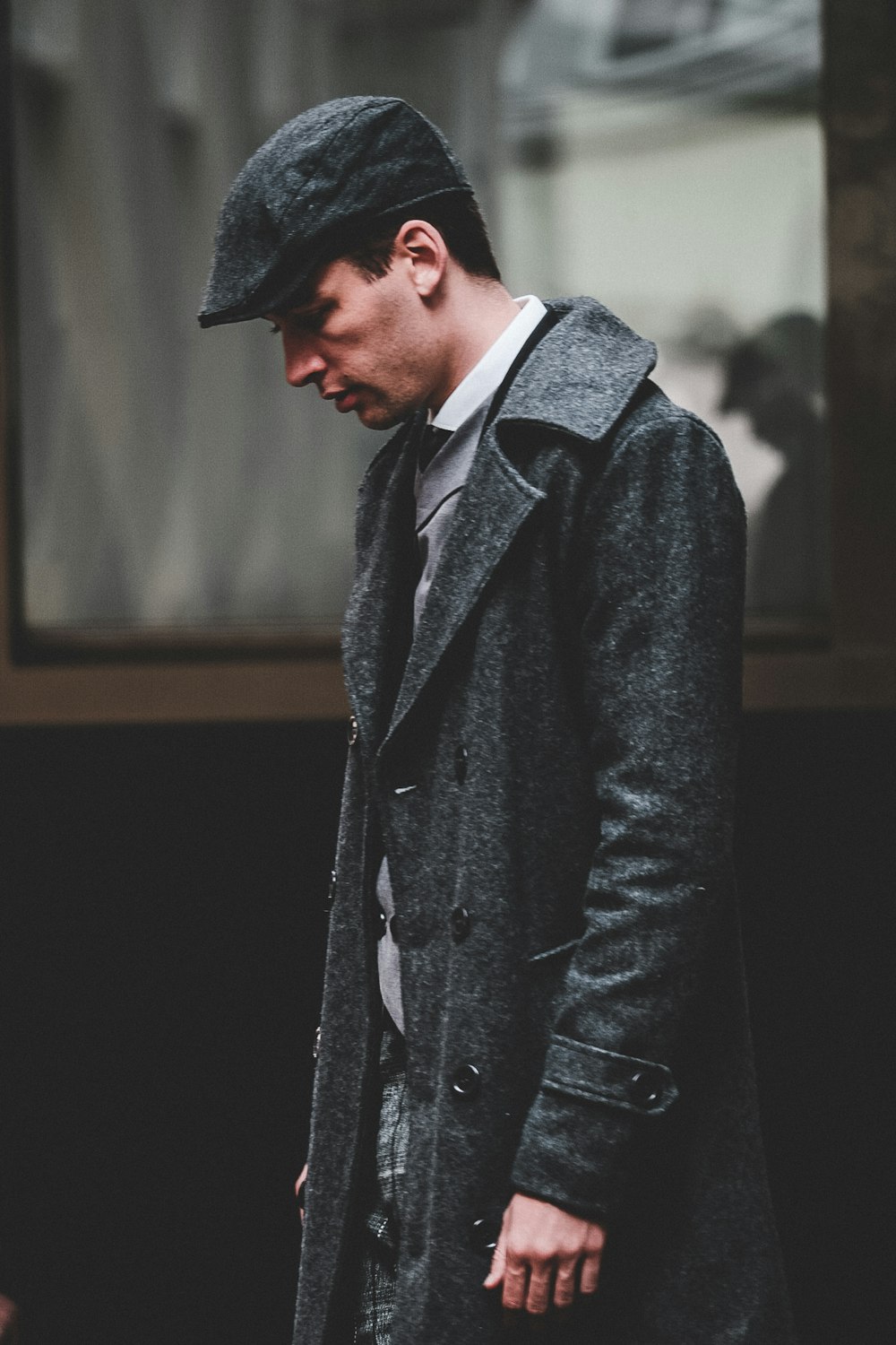 man wearing long coat