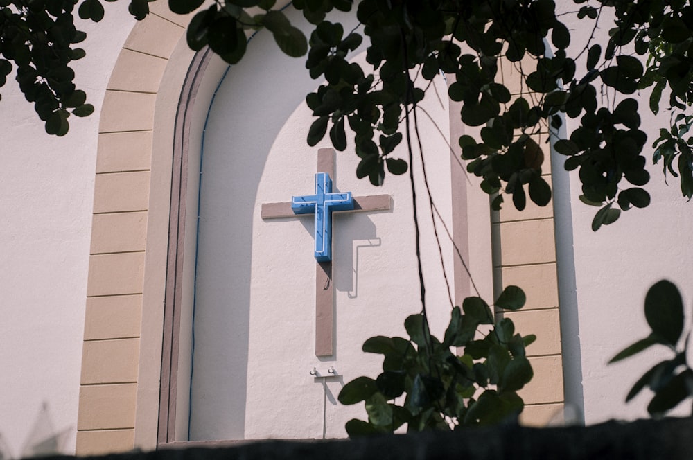 blue cross on cathedral wall