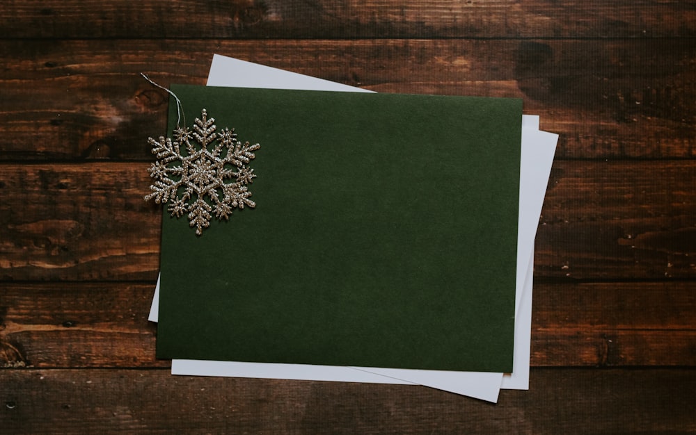 gray snowflake on green paper