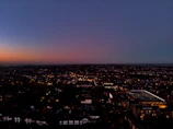 A panoramic view of Lahore’s business district at sunset, lights beginning to glow.