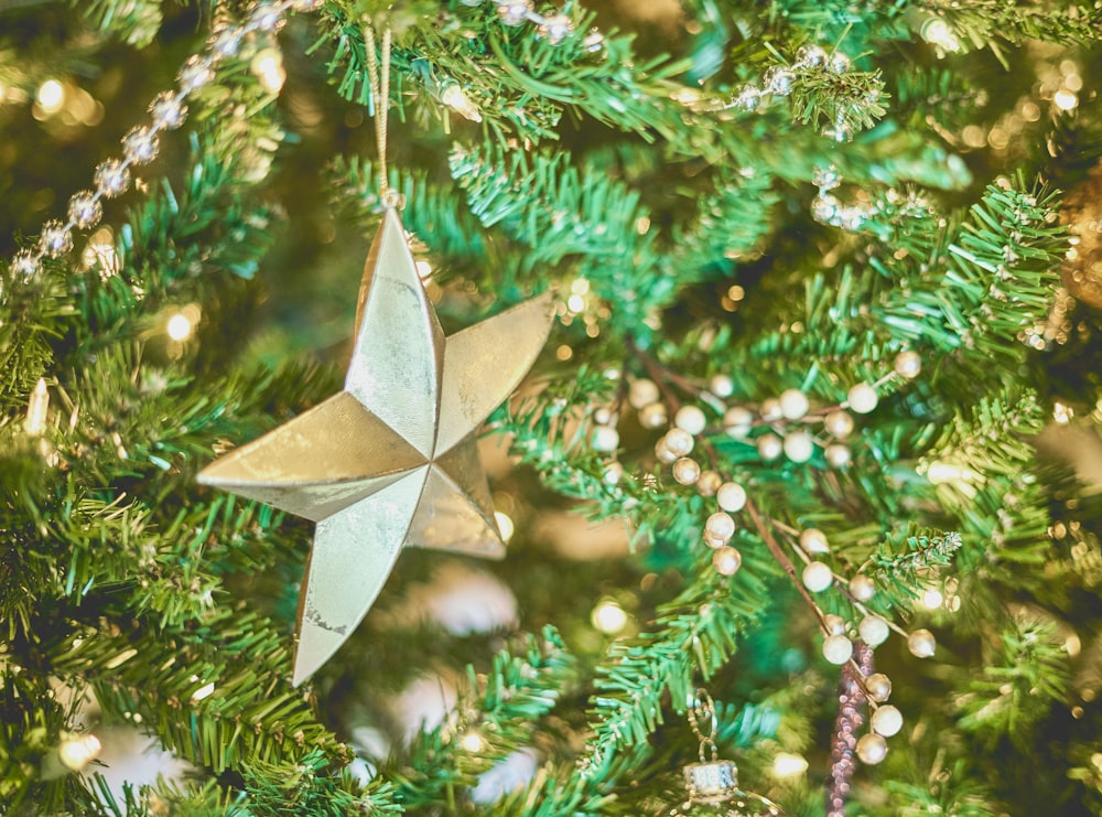green Christmas tree with star decor