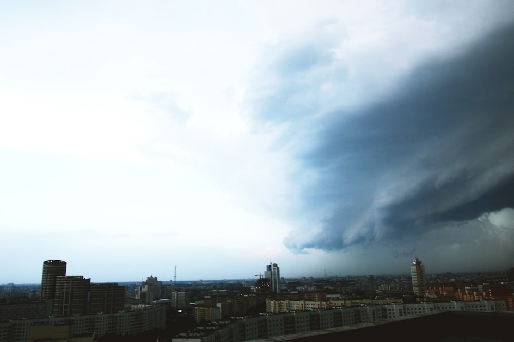 grey clouds over city skyline