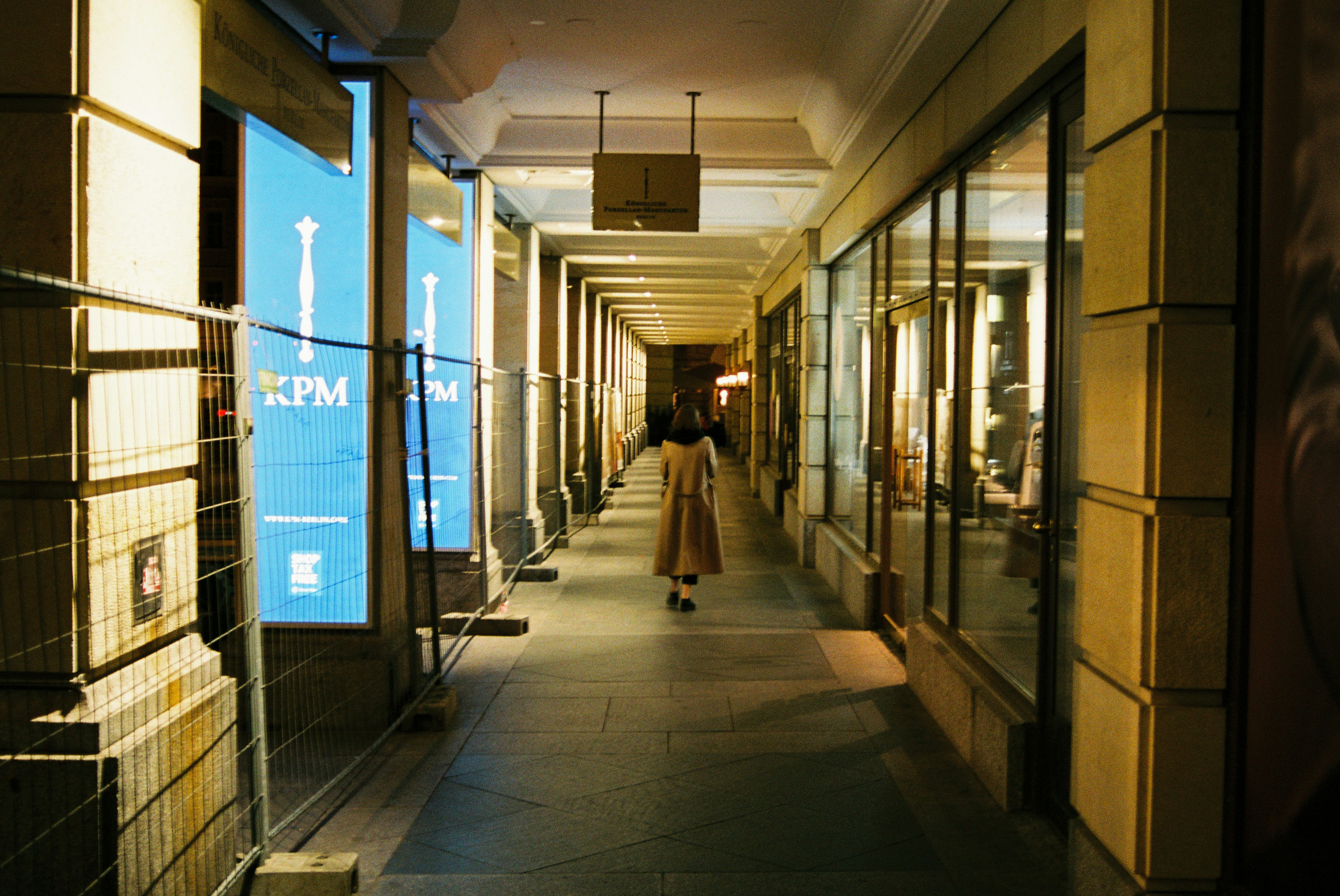woman walking on hallway inside building