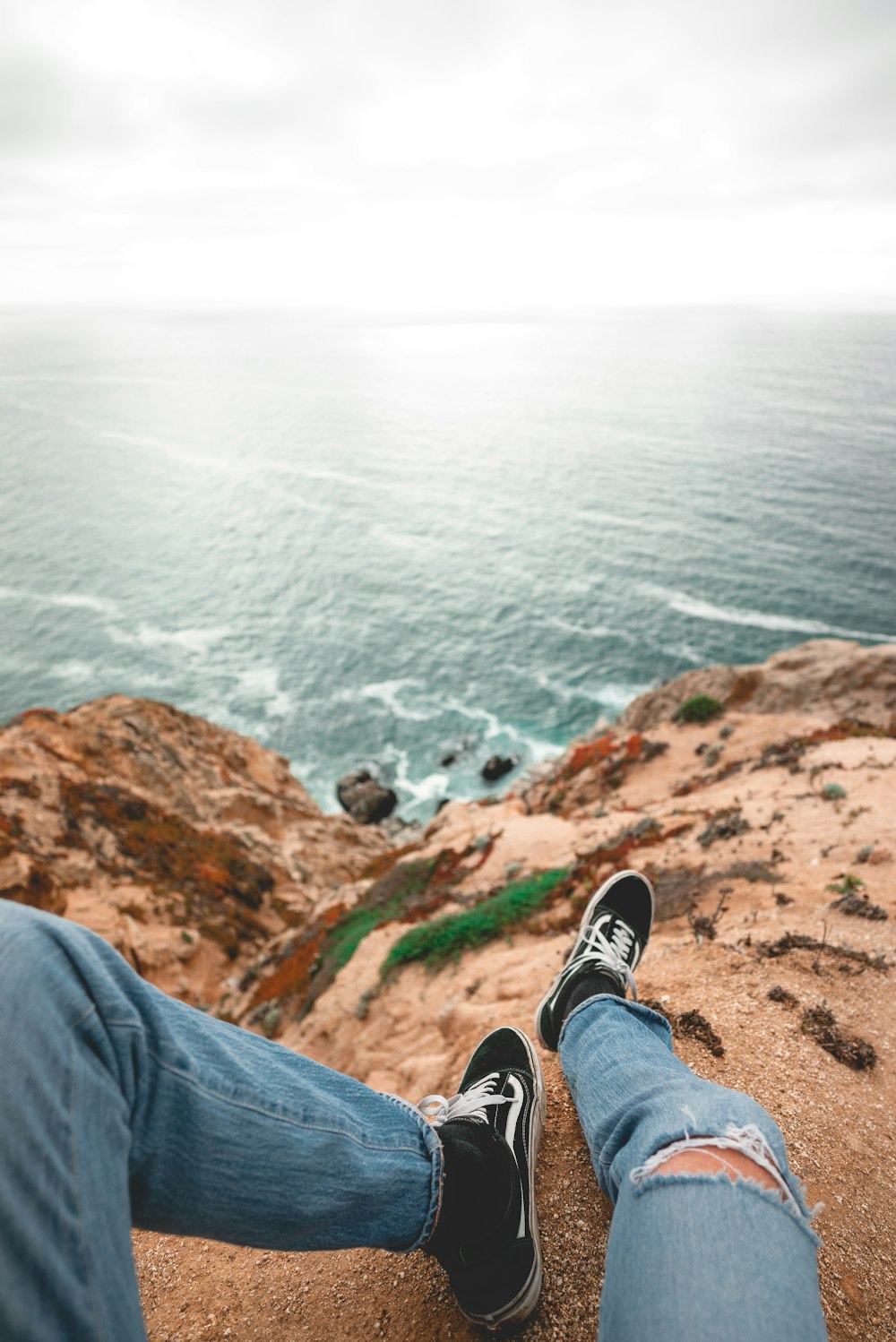 person sitting on rock formation