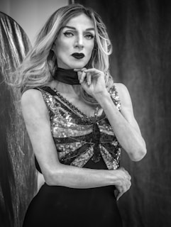 A striking portrait of Wendy Dawn David in a gold-accented black outfit, radiating confidence and creativity.