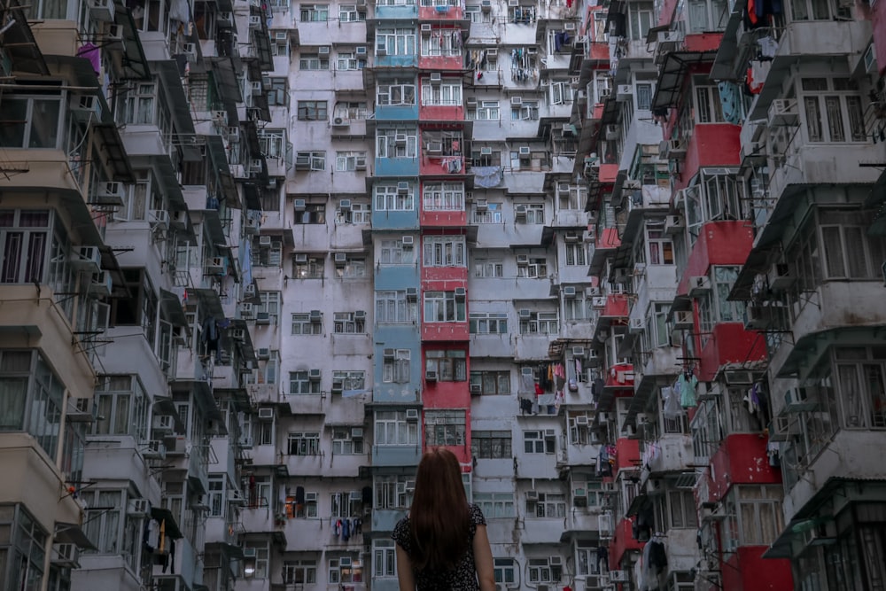 woman in front of high rise building