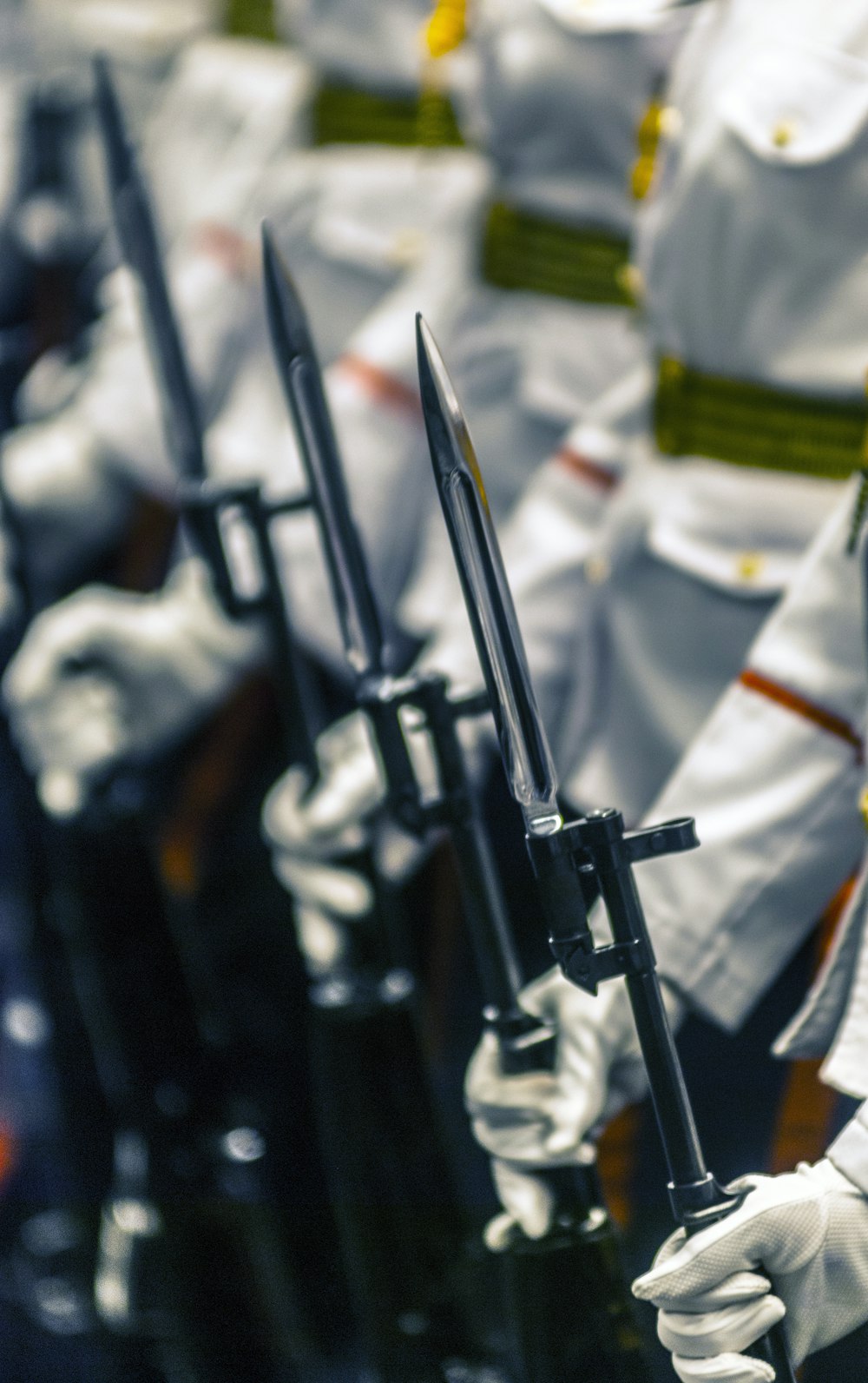 selective focus photography of people holding spears