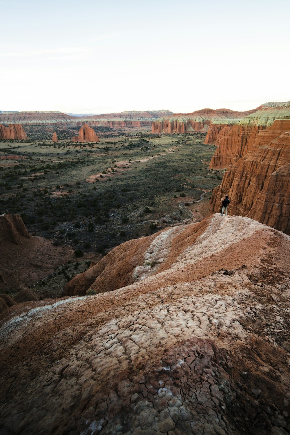 person standing on rock formation