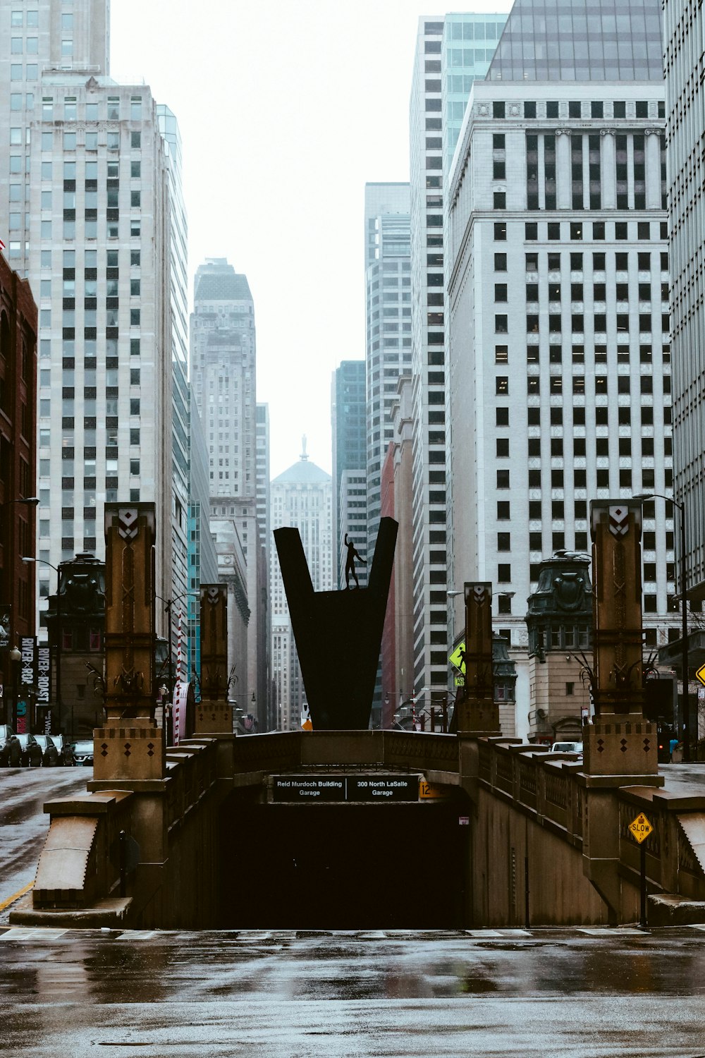 empty gray concrete tunnel during daytime