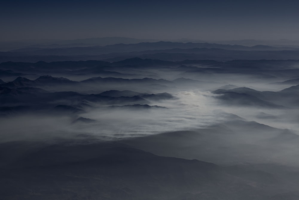aerial photography of sea of clouds over mountains