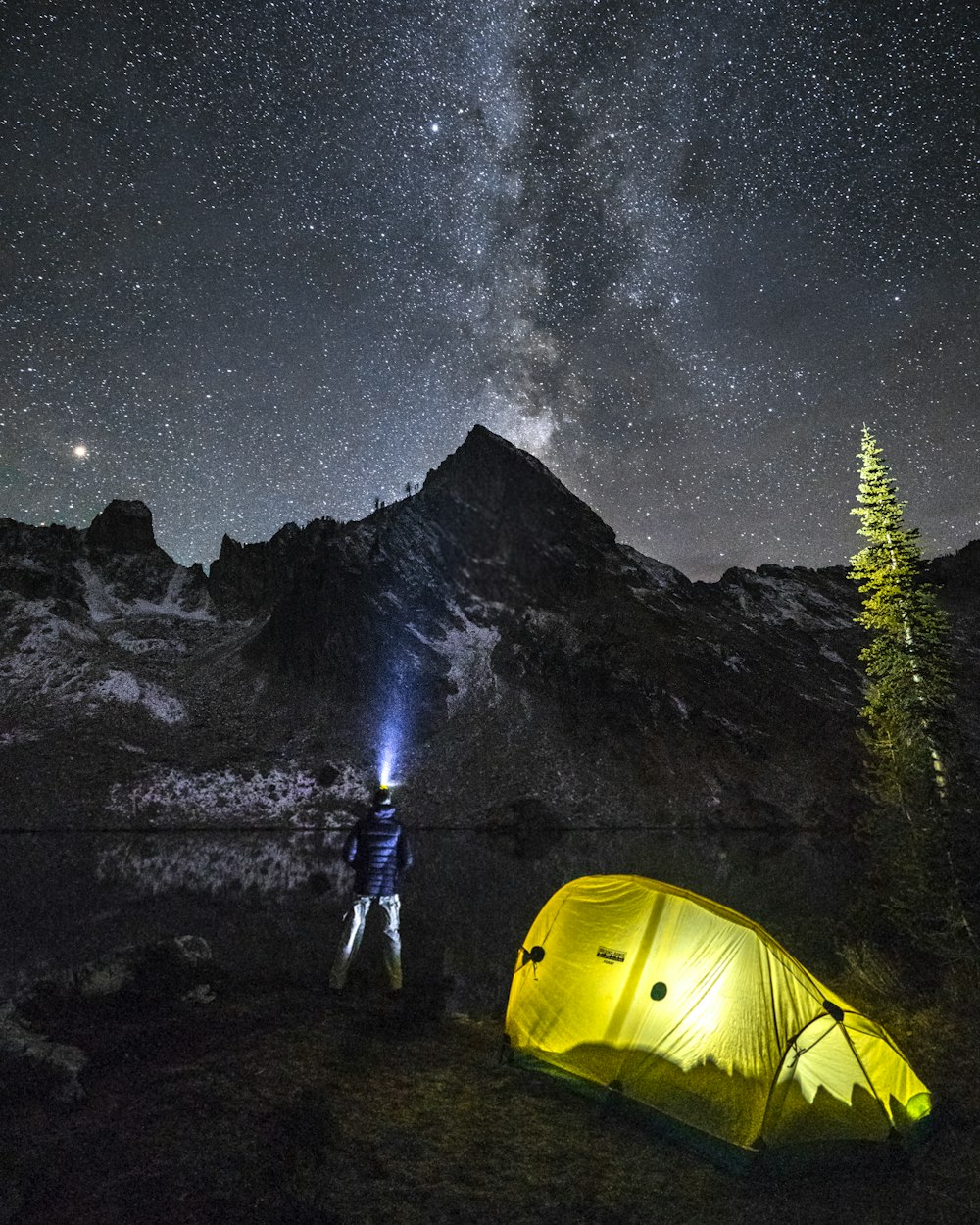 man standing near mountain at nighttime
