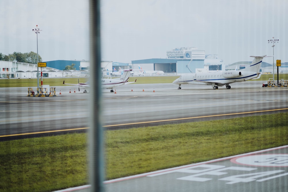 white planes on pavement