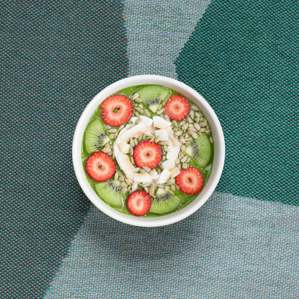 sliced fruits in white ceramic bowl