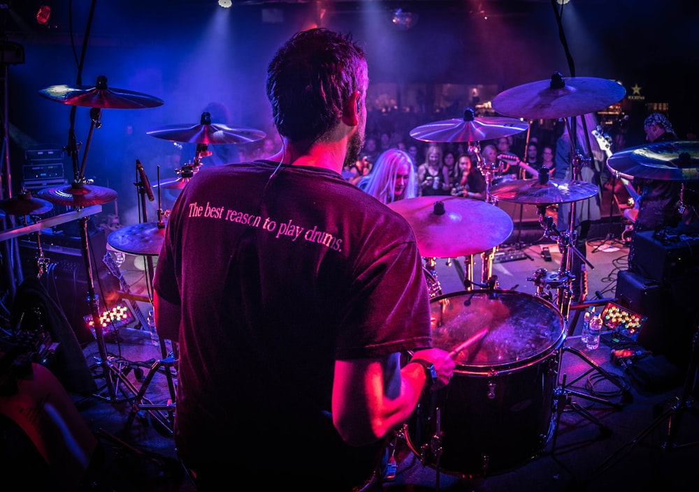 man playing drum on stage