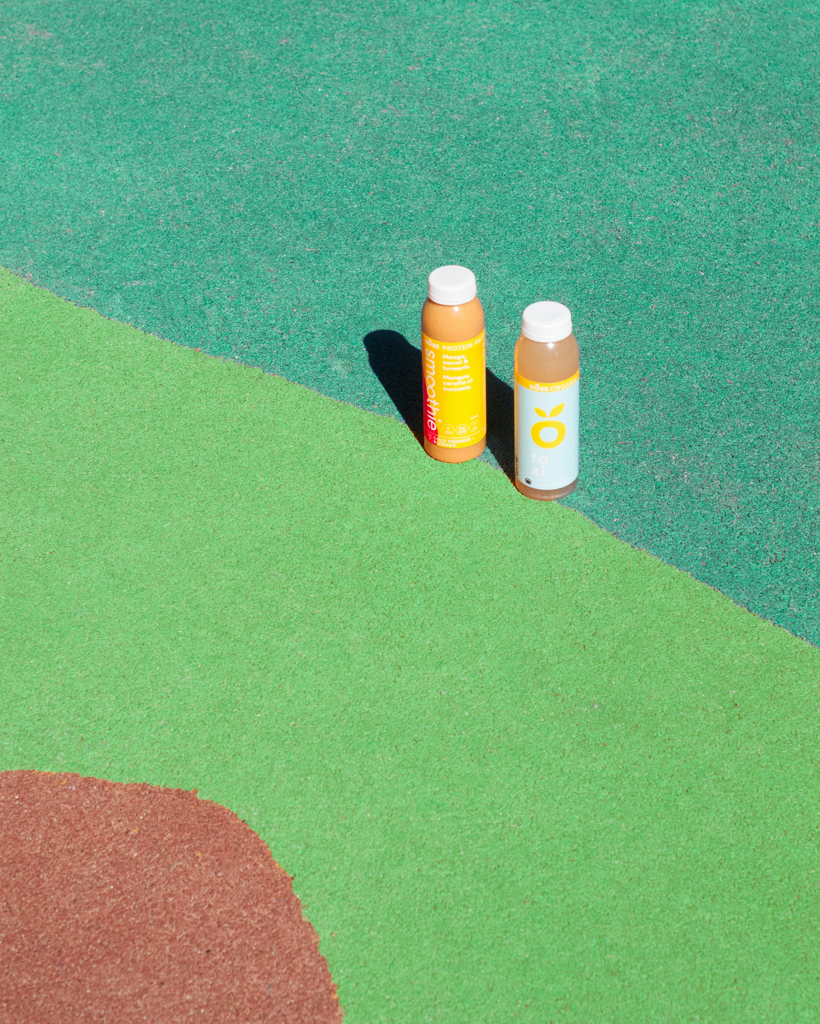 two orange and white labeled bottles