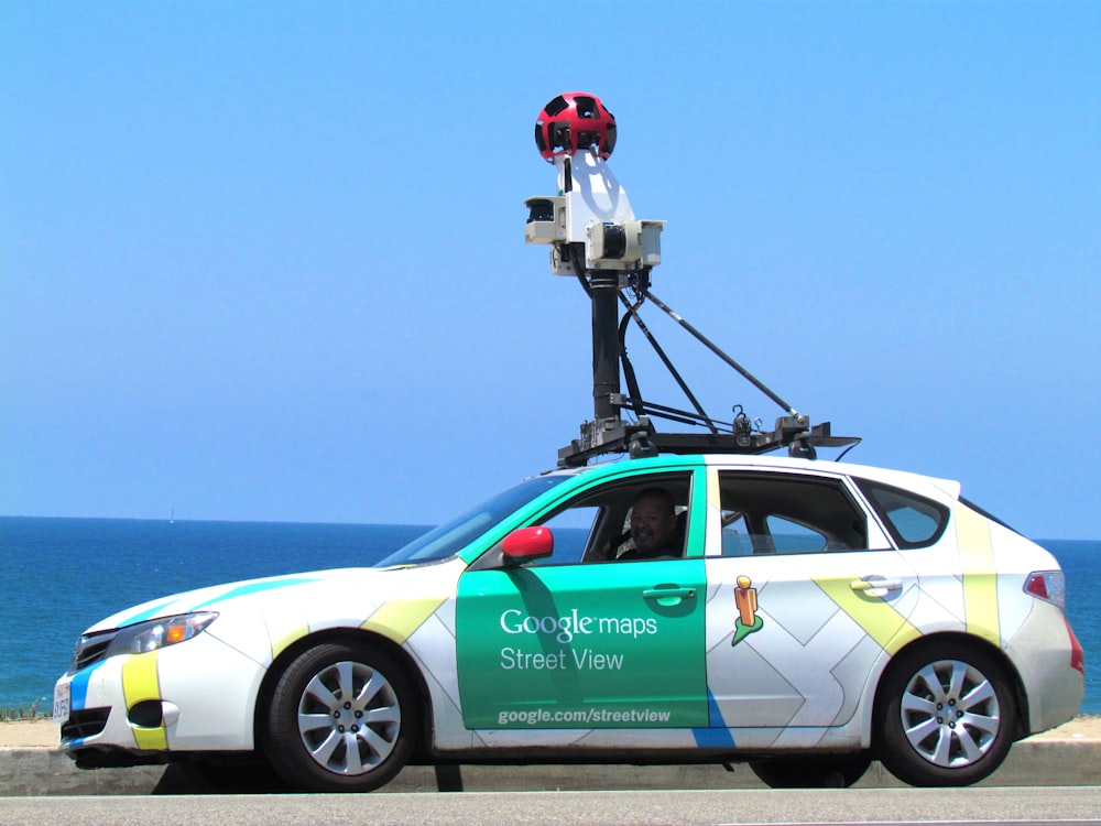 white and green Google Maps hatchback