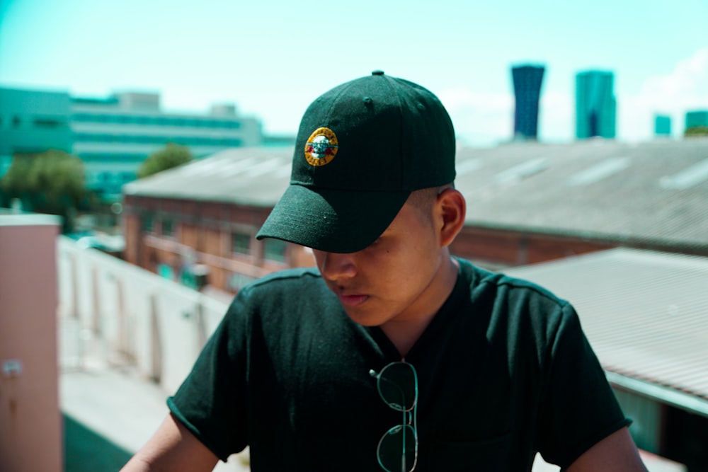 man wearing black cap