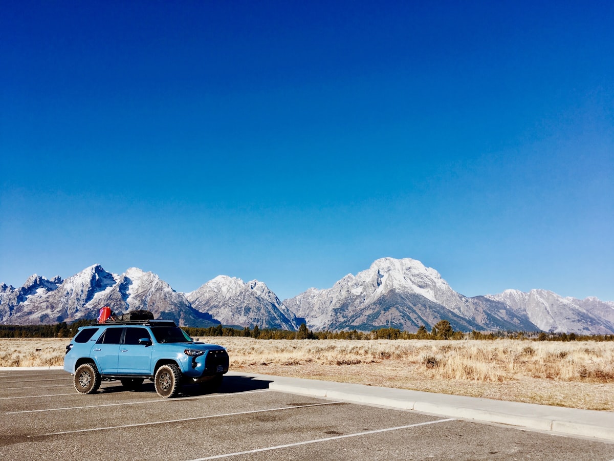 Blue Toyota 4Runner 5th generation overlanding on mountain trail