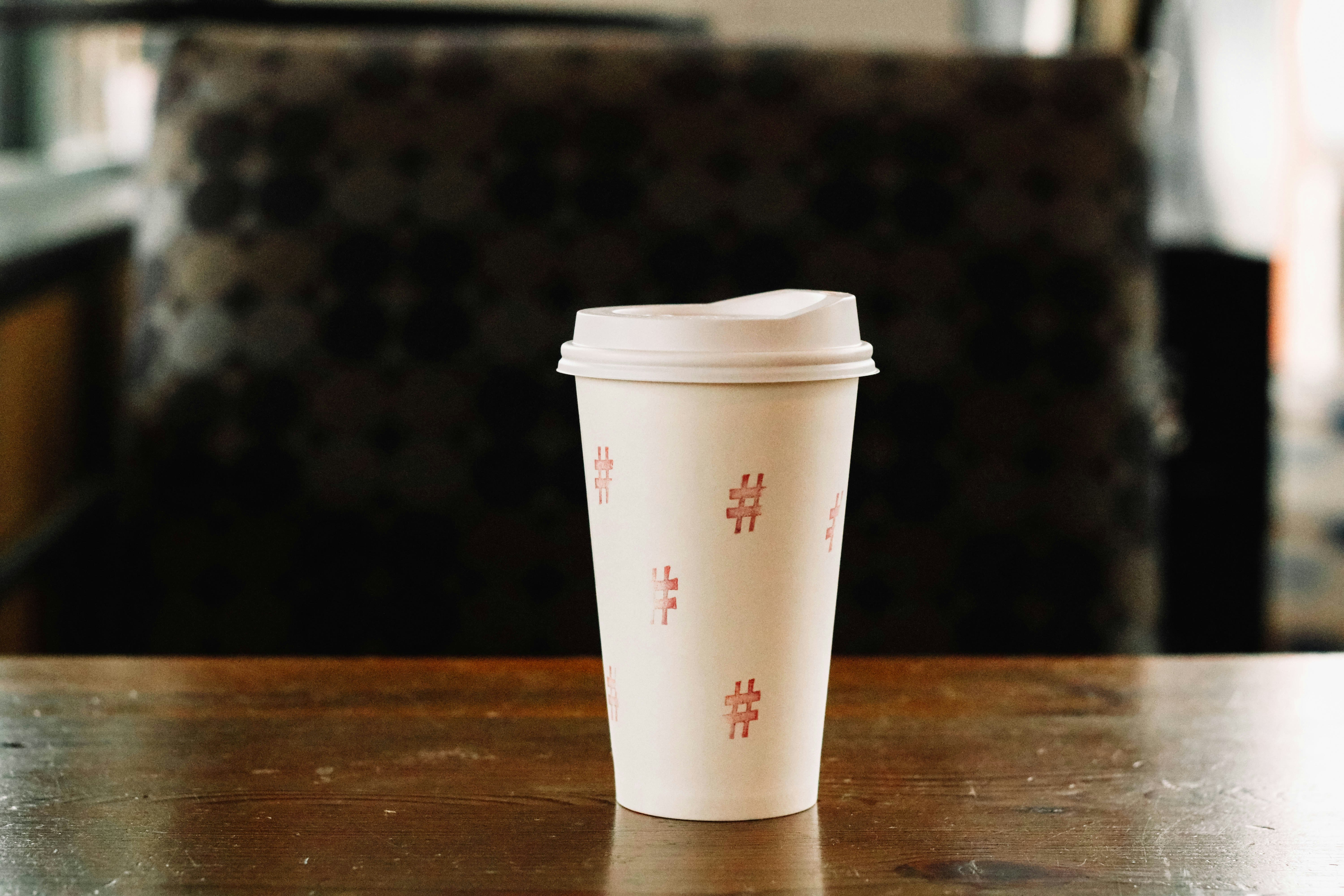 white tumbler on table