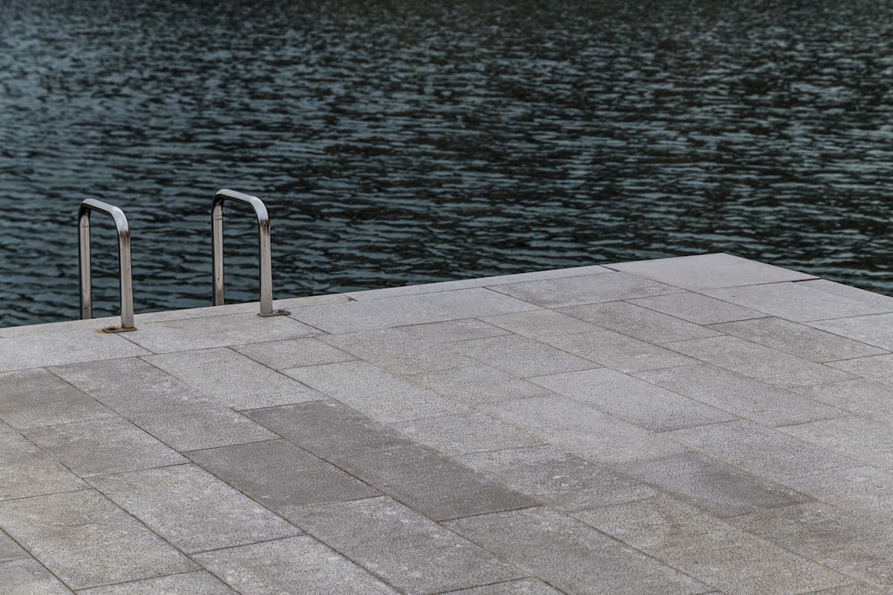 grey stainless steel railing on grey concrete dock