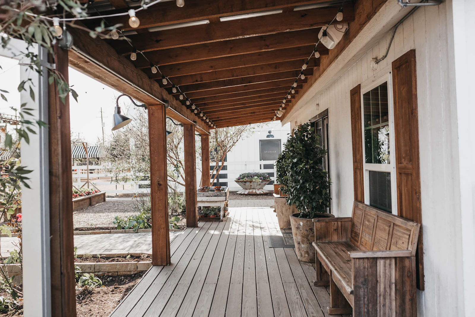 A finished covered porch running the length of a house
