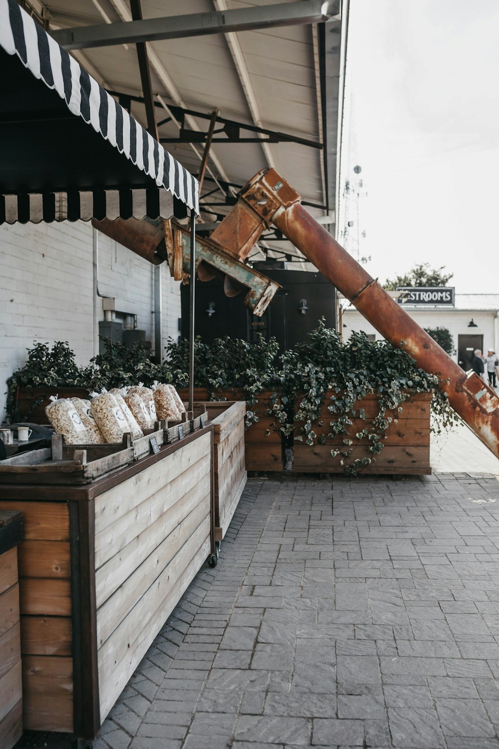 a large pipe sticking out of the side of a building