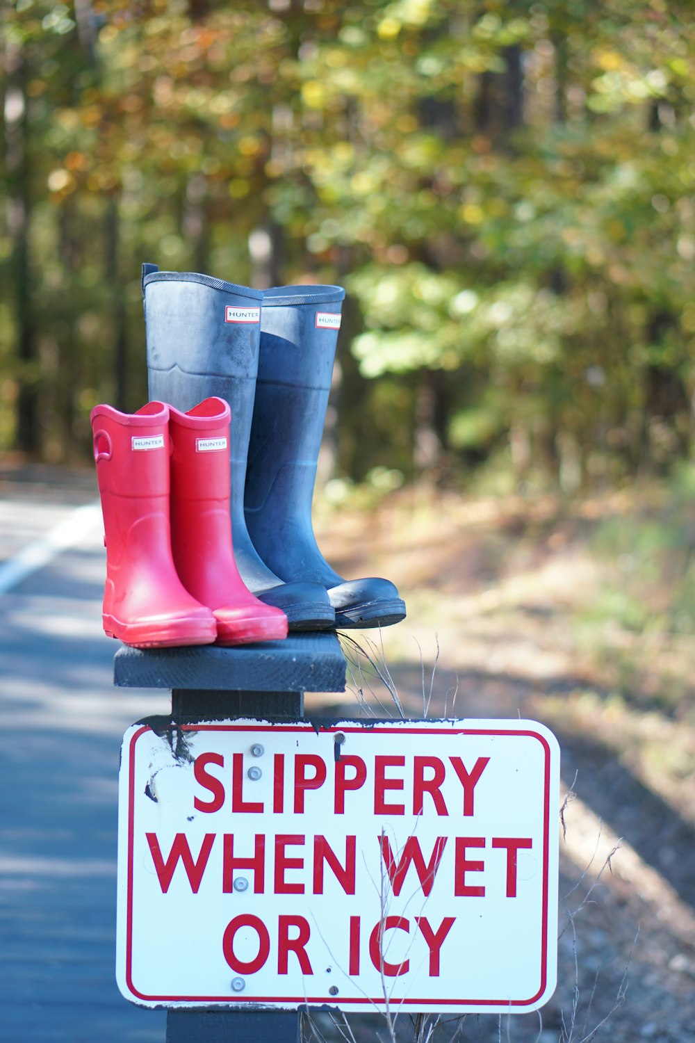 two red and black rain boots