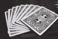 black playing cards on black surface