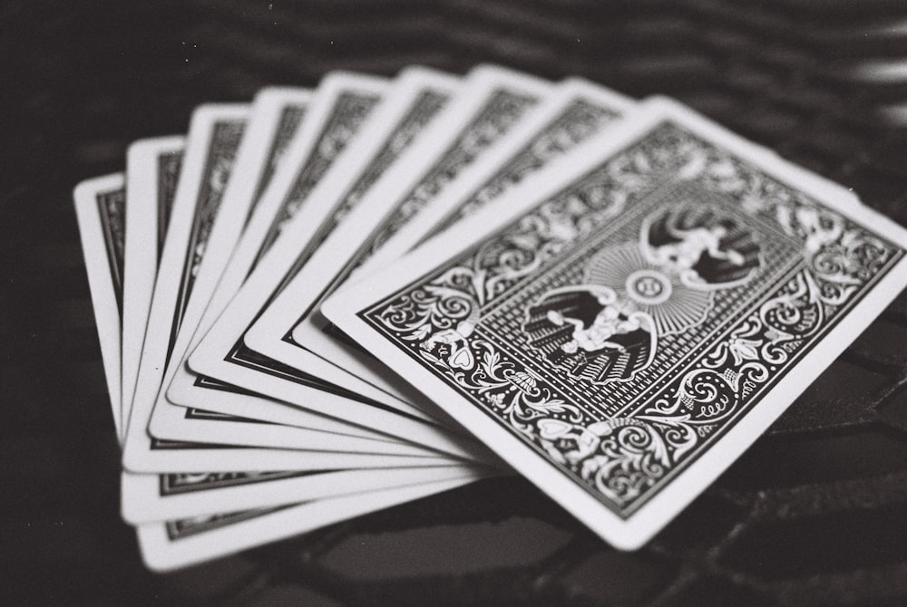 black playing cards on black surface