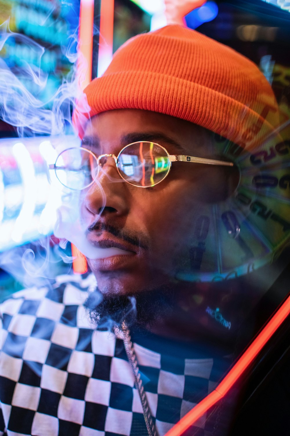 man in orange beanie smoking