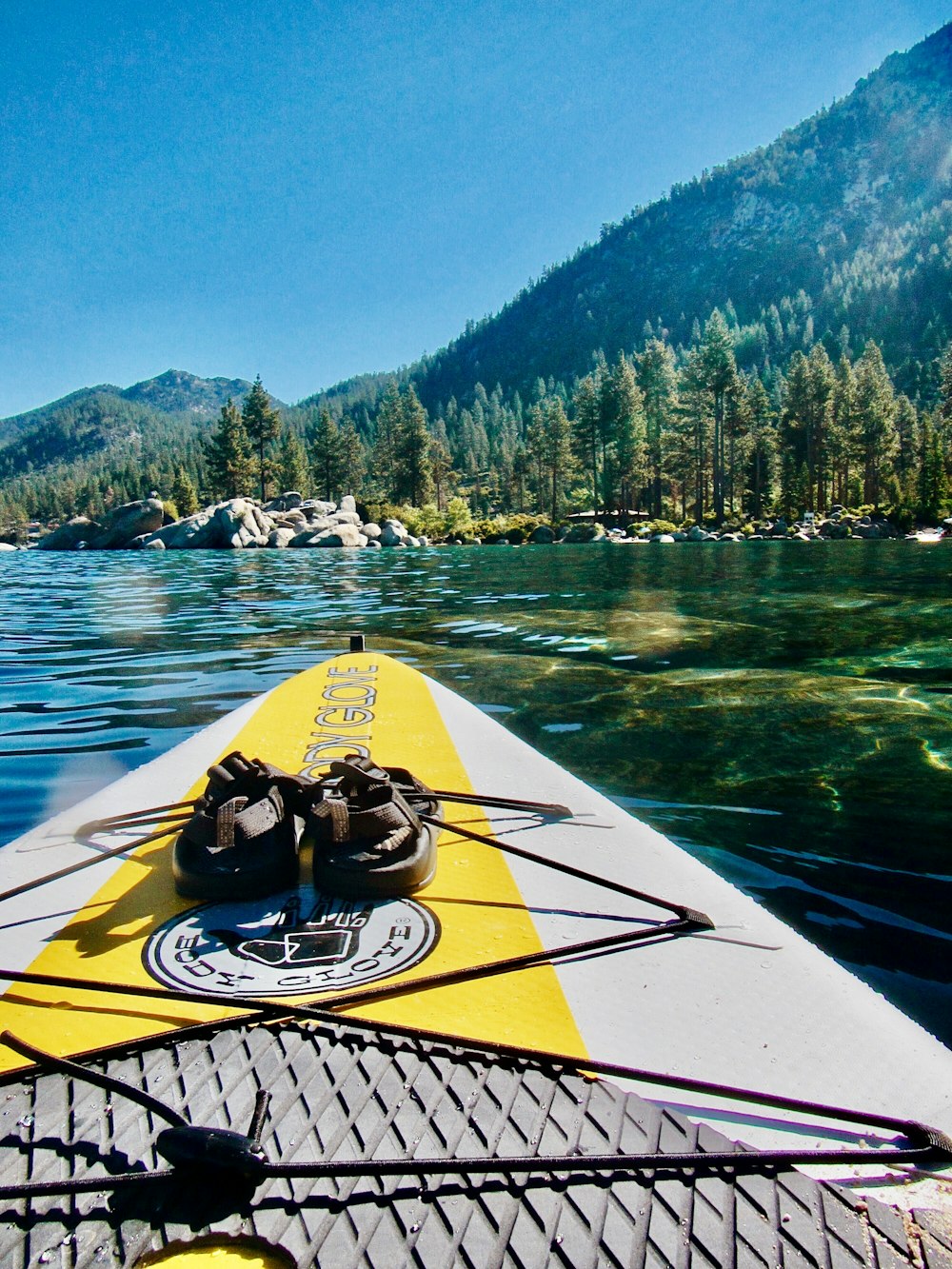 yellow and white surfboard on water