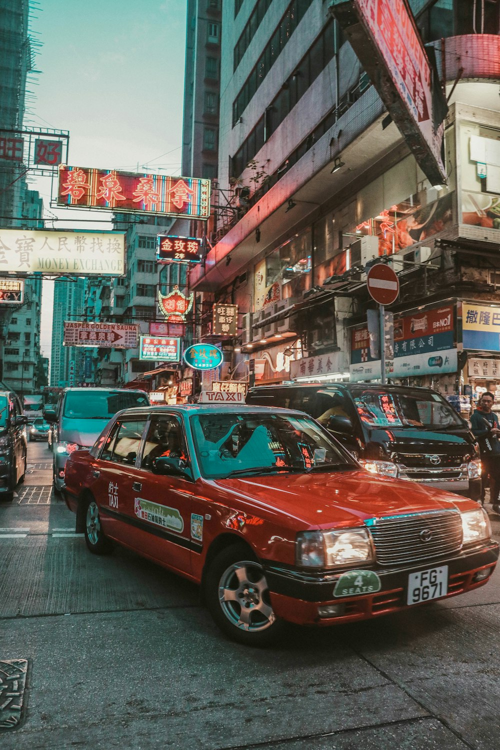 red taxi cab on Hong Kong street