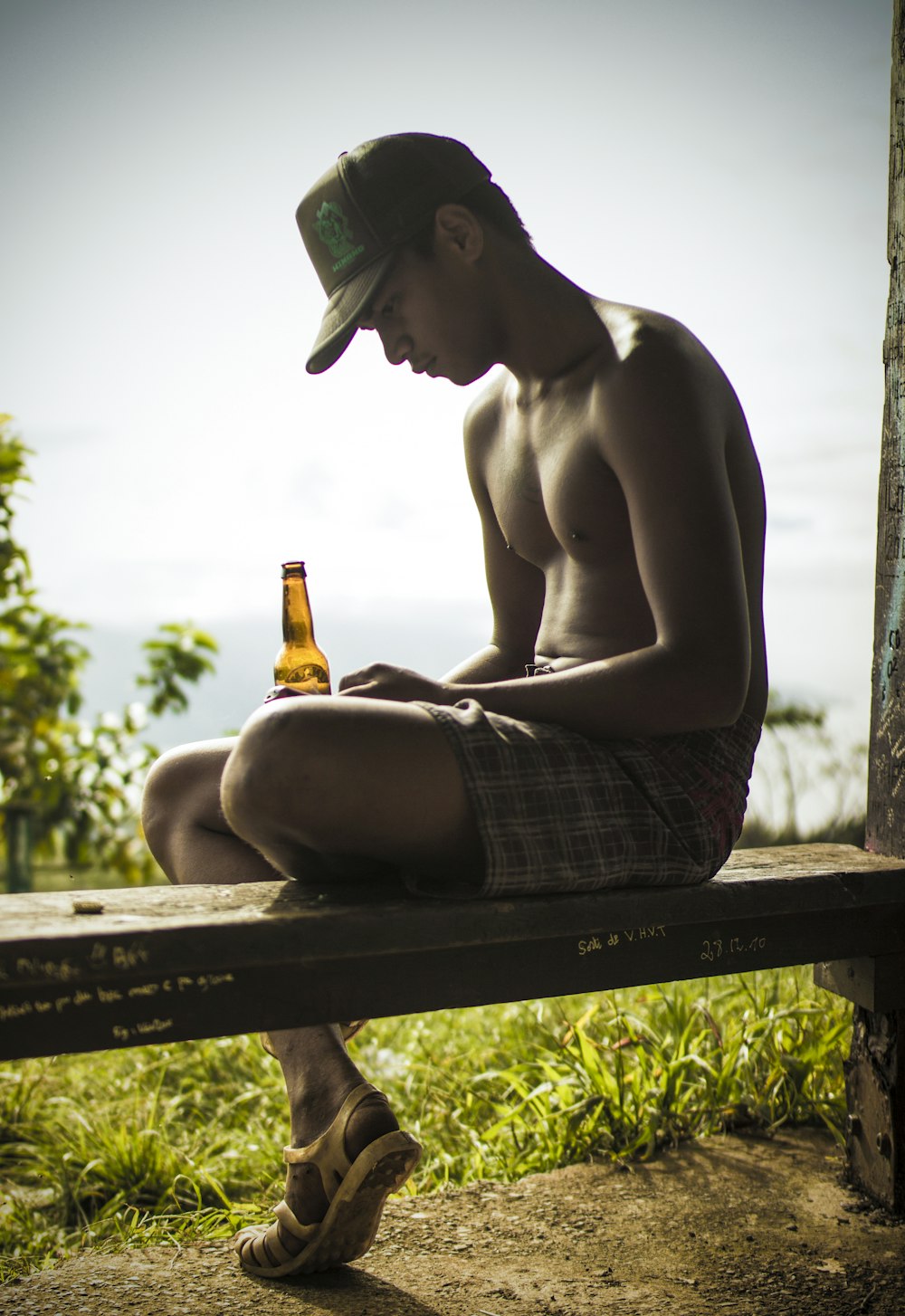 topless man sitting down