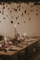 A rustic table set with traditional Brazilian dishes under warm lighting.