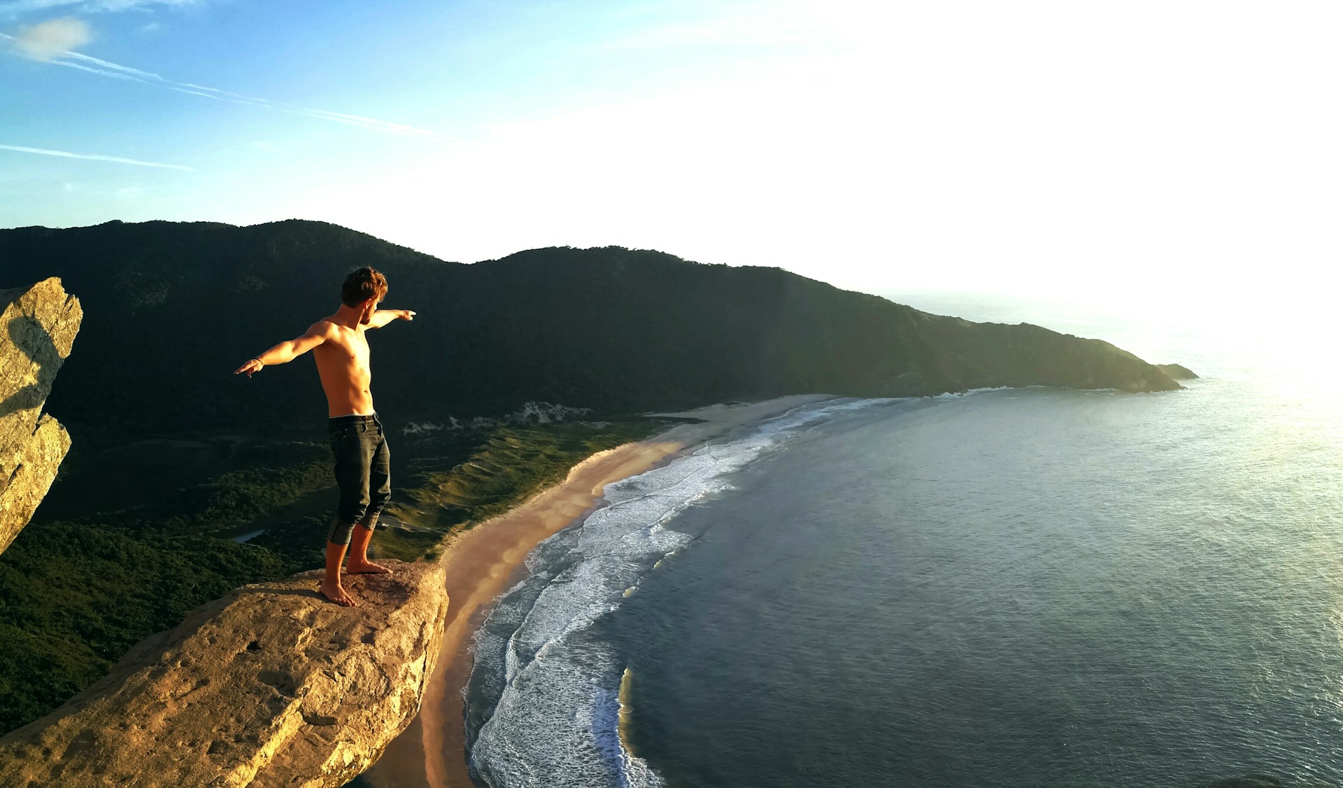 man standing on seashore