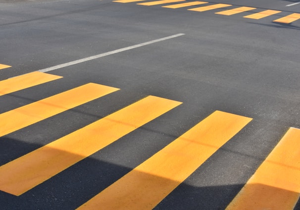 gray and yellow concrete roadway at daytime