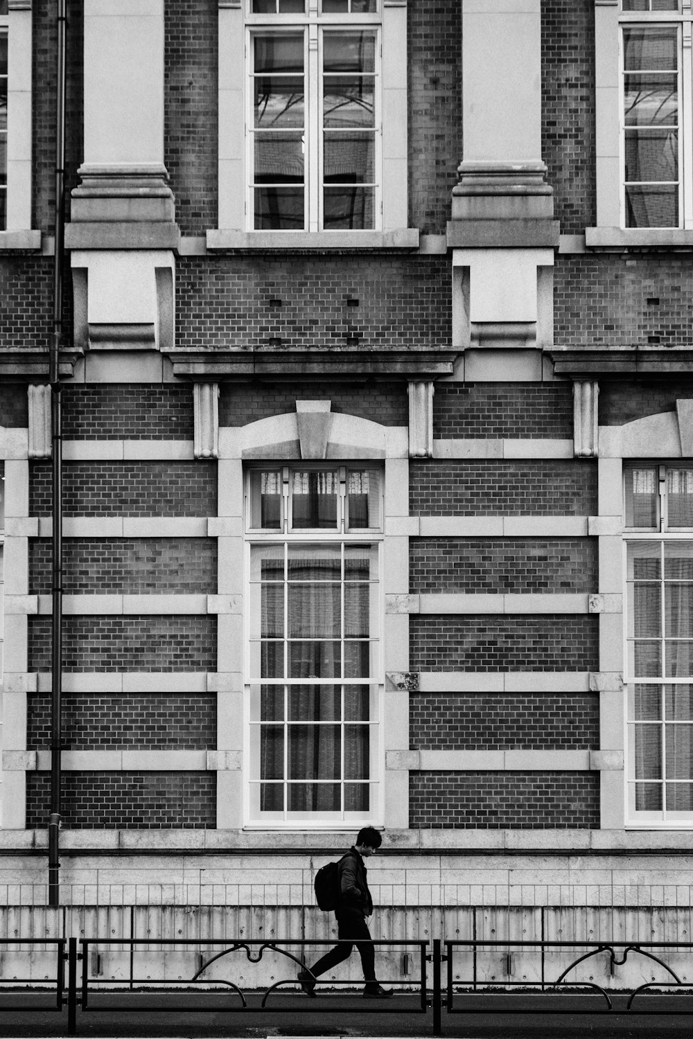 man walking near building