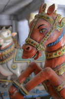 Close-up of a vibrant Kondapalli wooden horse painted in traditional colors.