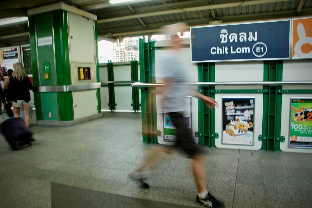 man standing near gate