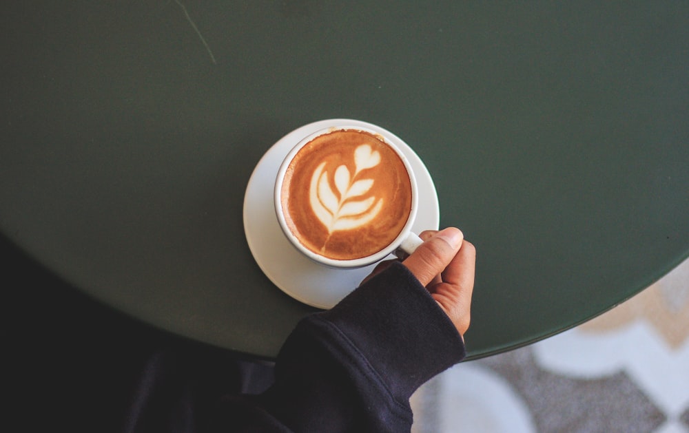 person holding cup