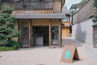A minimalist, elegant signpost marking the entrance to a vineyard property.