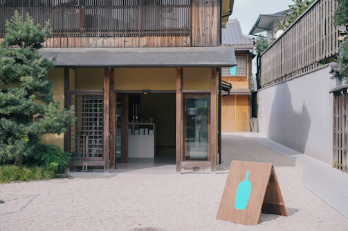 A minimalist, elegant signpost marking the entrance to a vineyard property.